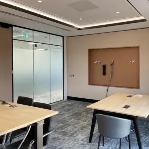 Finished office room with multi-level ceiling, shadow gap lighting, glazed partition and TV recess