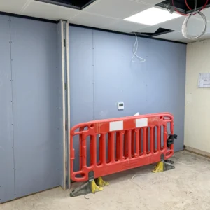QIC aluminium partition fixed to the ceiling, prepared for glazing installation