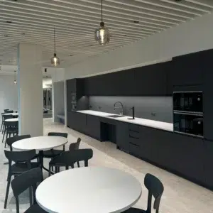 Office tea point kitchenette with fitted units and finished commercial interior